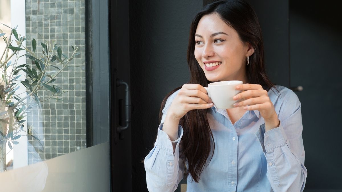 Woman holding coffee cup