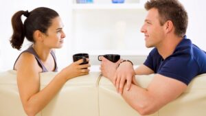 Couple drinking coffee at home